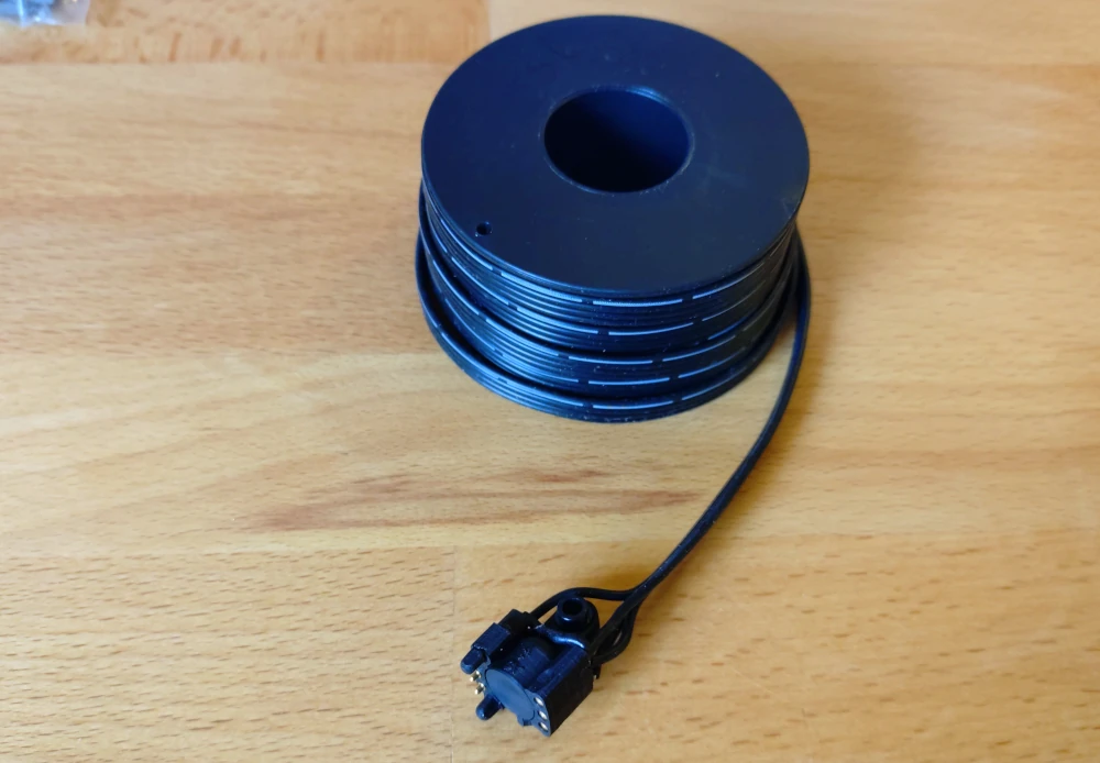 The fixed contact is glued into the coupler